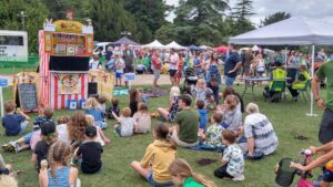 Large crown of children waiting for a Punch and Judy show